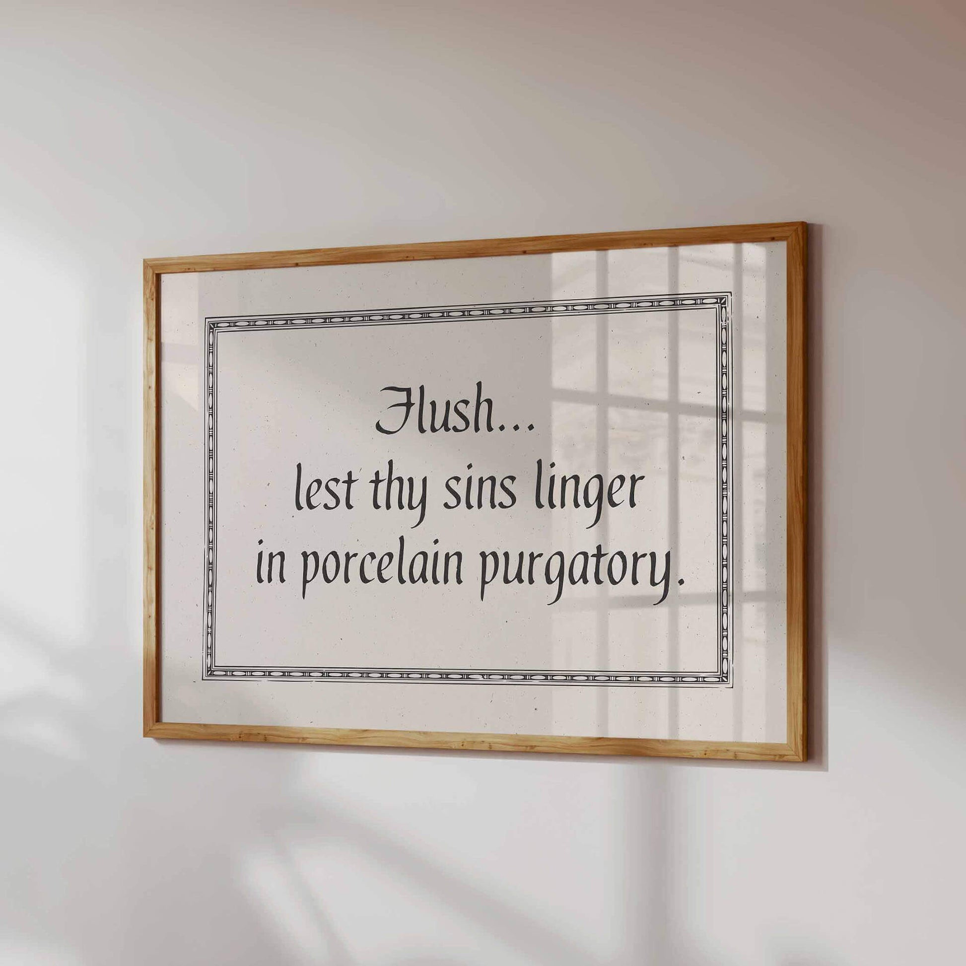 a framed quote on a wall, which reads "Flush... last thy sins linger in porcelain Purgatory."