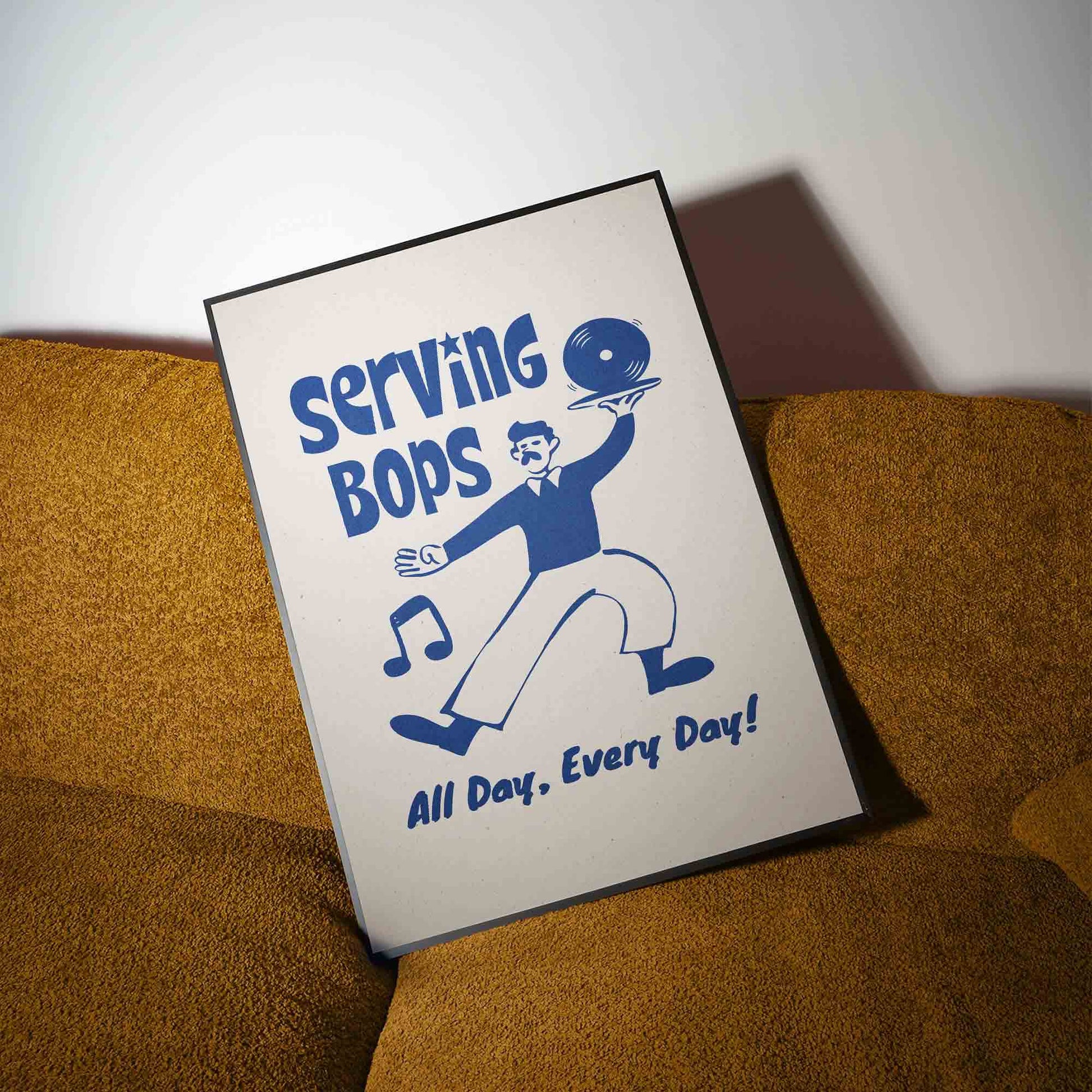 A poster with a cartoon illustration of a man serving food, accompanied by the text "Serving Bops All Day, Every Day!"